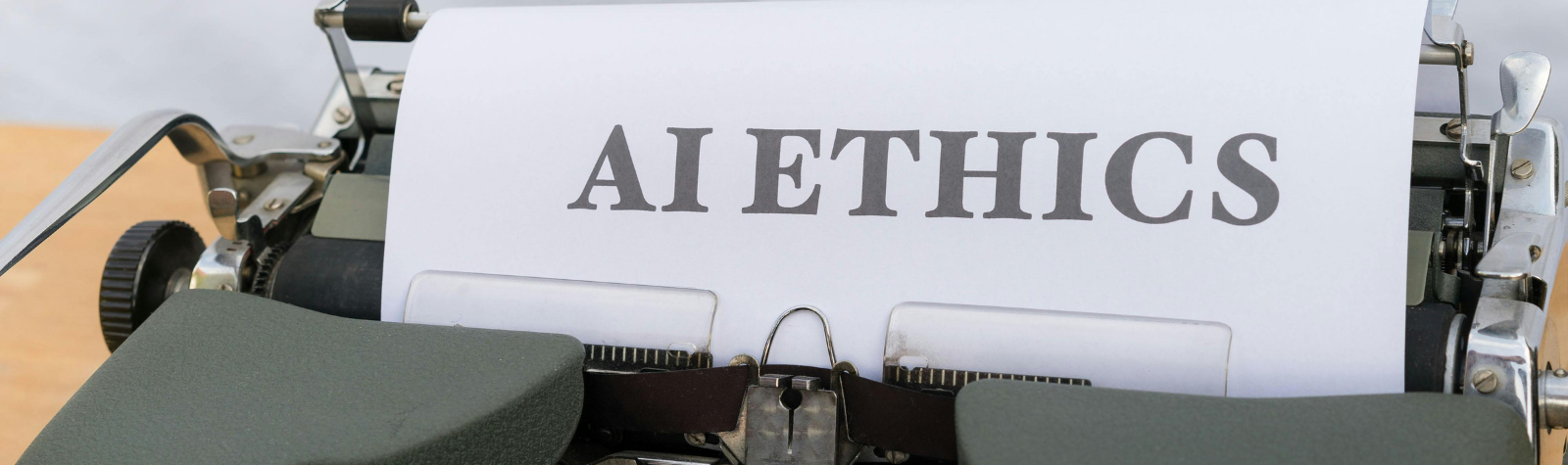 Typewriter with a paper that says AI ETHRICS, Typewiser, AI and Open Science, 